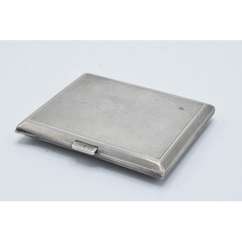 350 - A silver and black enamel cigarette case, Adie Bros Ltd, Birmingham 1932. Gross weight 97.6 grams.