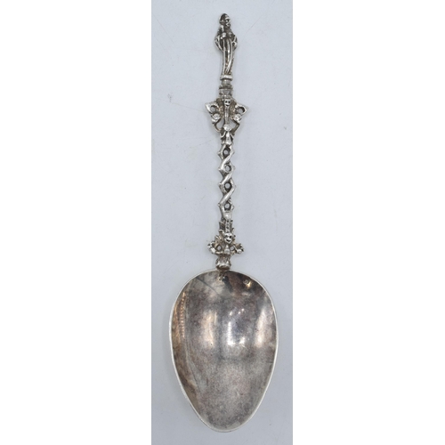 359 - A silver spoon with ornate handle and figural finial, presumed Dutch, with English assay marks. 52.1... 