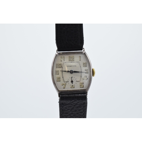 392 - A vintage Tiffany and Co sterling silver wristwatch on black leather Condor strap, in ticking order ... 