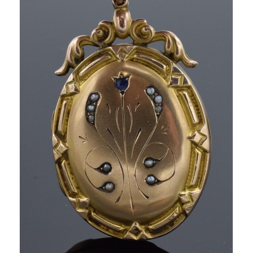 406 - 9ct gold oval hinged locket set with seed pearls and sapphire with engraved decoration with metal in... 