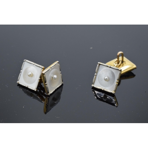 412 - A pair of 9ct gold and platinum cufflinks with Mother of Pearl and seed pearl design (2). 5.6 grams.