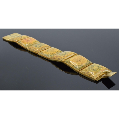 414 - Yellow metal and oriental panel bracelet. 19.5cm long.