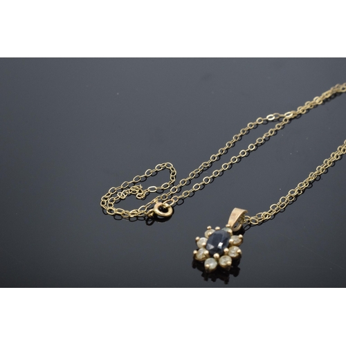 429 - 9ct gold chain and 9ct gold pendant set with sapphire and CZs. 1.2 grams. Chain approx 40cm long.