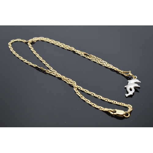 433 - 14ct gold necklace with 14ct gold and white gold dolphins pendant. 5.7 grams. 46cm long.