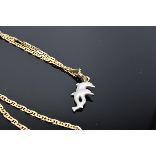 433 - 14ct gold necklace with 14ct gold and white gold dolphins pendant. 5.7 grams. 46cm long.