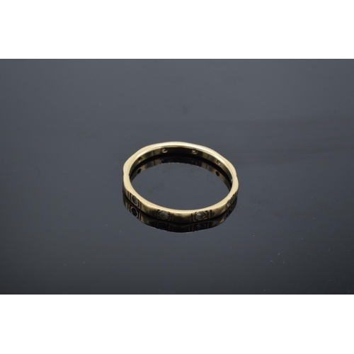 435 - 9ct gold stone set eternity ring. 1.2 grams. Size M/N.