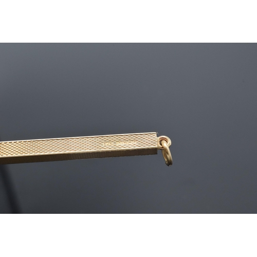 465A - 9ct gold mechanical cocktail stirrer with engineered decoration, 6.5 grams gross weight.