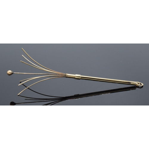 465B - 9ct gold mechanical cocktail stirrer, unmarked though tests as 9ct gold, 5.4 grams gross weight.