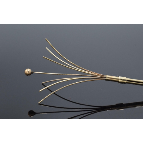 465B - 9ct gold mechanical cocktail stirrer, unmarked though tests as 9ct gold, 5.4 grams gross weight.