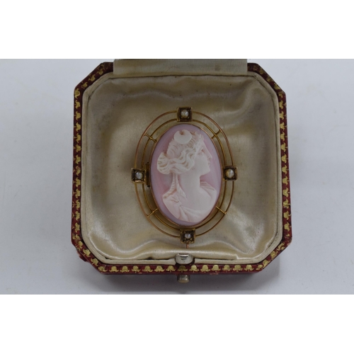 466 - 9ct gold pink carved coral cameo brooch set seed pearls, weight 6.9g, 35mm high.