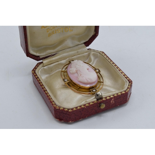 466 - 9ct gold pink carved coral cameo brooch set seed pearls, weight 6.9g, 35mm high.