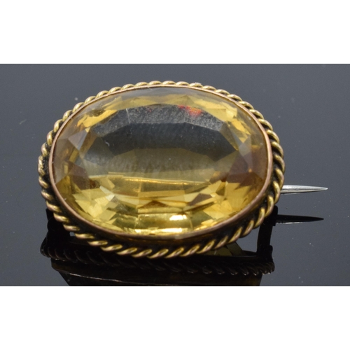 468 - Gold mounted citrine brooch, not hallmarked but tested as 9ct or better.  Weight 6.5g, 22mm wide.