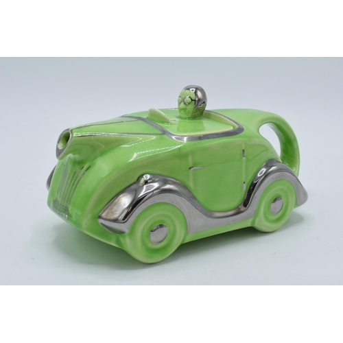 47 - A 1930s Art Deco Sadler racing car teapot in lime green glaze with silvered detailing Reg No 820236,... 