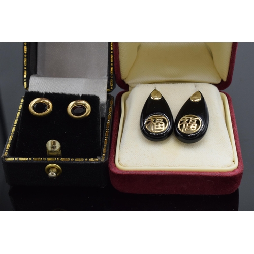 471 - 14ct gold Chinese design earrings plus 9ct gold and garnet pair.  Not hallmarked but tested as descr... 