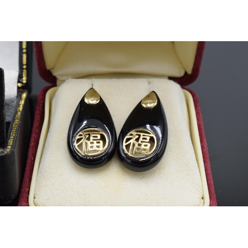 471 - 14ct gold Chinese design earrings plus 9ct gold and garnet pair.  Not hallmarked but tested as descr... 