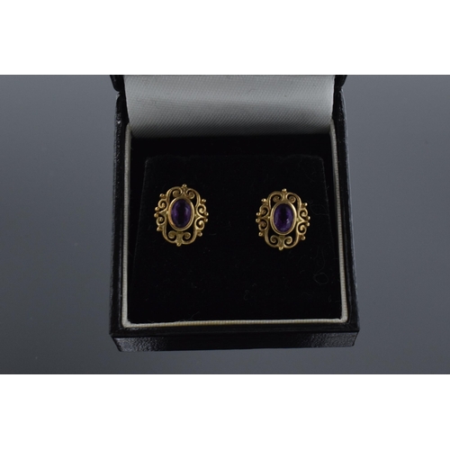 472 - 9ct gold and amethyst earrings