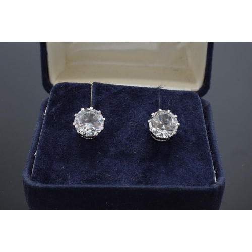 475 - 9ct gold Ciro earrings set CZ single stones appx. 8mm each diameter.