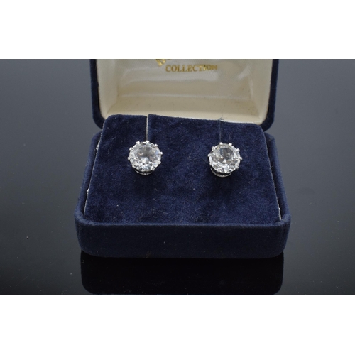 475 - 9ct gold Ciro earrings set CZ single stones appx. 8mm each diameter.