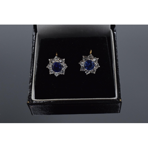 476 - 9ct gold blue & white sapphire screw back earrings, face measuring 10mm appx.