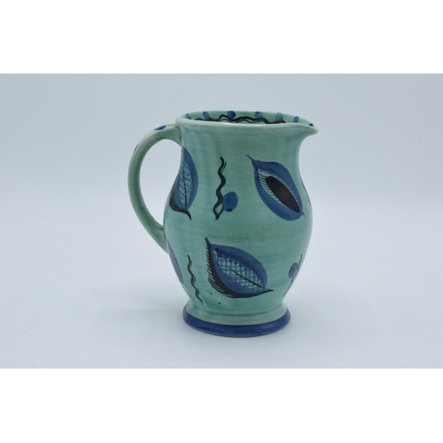 47D - A Susie Cooper blue and green mottled glaze shouldered jug with stylised decoration, 16cm tall.