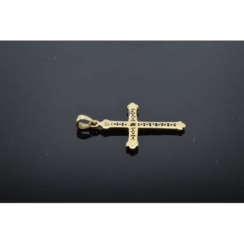 486 - 9ct gold crucifix pendant set with CZ stones. 0.8 grams. 20mm tall.