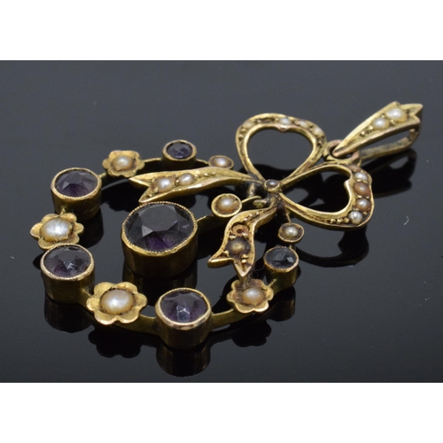 487 - Antique 15ct gold pendant set with amethysts and seed pearls in the form of a bow, 2.8 grams. 35mm t... 