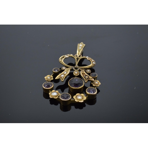 487 - Antique 15ct gold pendant set with amethysts and seed pearls in the form of a bow, 2.8 grams. 35mm t... 