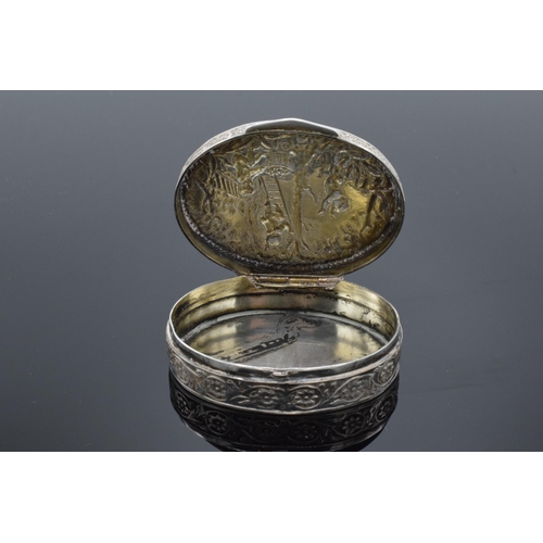 488 - An ornate sterling silver oval pill box with repousse cherub decoration with UK assay marks. 35.7 gr... 