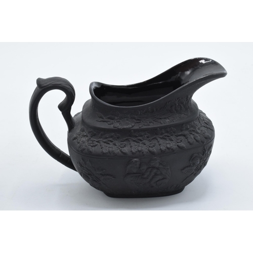 82 - A trio of 19th century black basalt cream jugs to include one with floral impressed number '34' to b... 