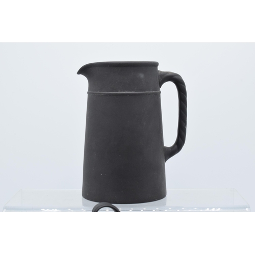 88 - A collection of mainly 19th century Wedgwood black basalt jugs of varying forms to include a taller ... 