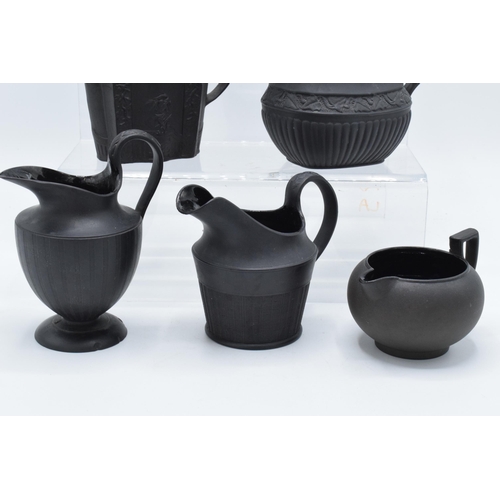 89 - A collection of mainly 19th century black basalt cream jugs to include named examples such as Wedgwo... 