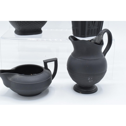 90 - A collection of mainly 19th century black basalt cream jugs to include a shallow Wedgwood example, j... 