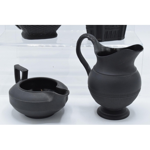 90 - A collection of mainly 19th century black basalt cream jugs to include a shallow Wedgwood example, j... 