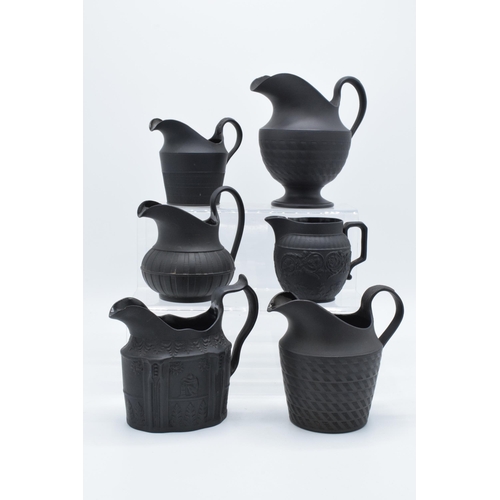 91 - A collection of mainly 19th century black basalt cream jugs to include two Wedgwood examples, one wi... 