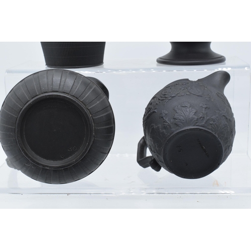 91 - A collection of mainly 19th century black basalt cream jugs to include two Wedgwood examples, one wi... 