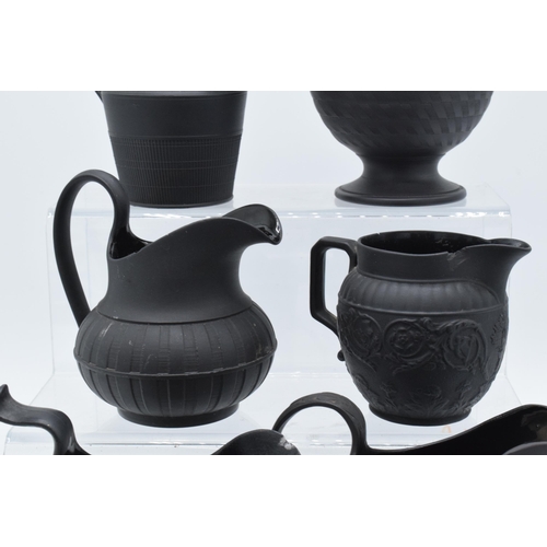 91 - A collection of mainly 19th century black basalt cream jugs to include two Wedgwood examples, one wi... 