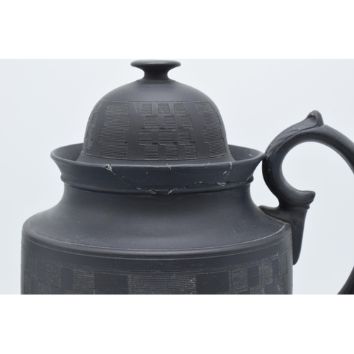 93 - A late 18th century / early 19th century, circa 1800, black basalt coffee pot and cover with engine-... 