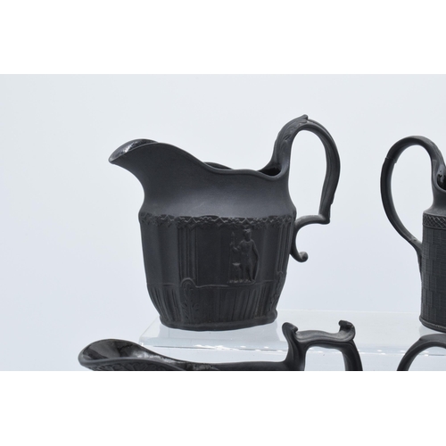 94 - A black basalt cream jug circa 1795 - 1800, attributed to Wilson, together with 3 others, the first ... 