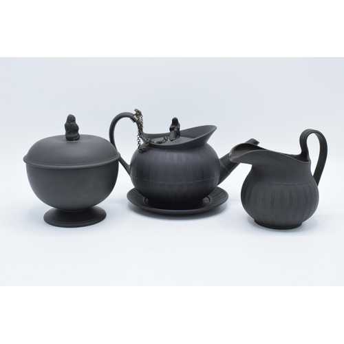 97 - A collection of early 19th century Wedgwood black basalt comprising a globular teapot and cover, a j... 