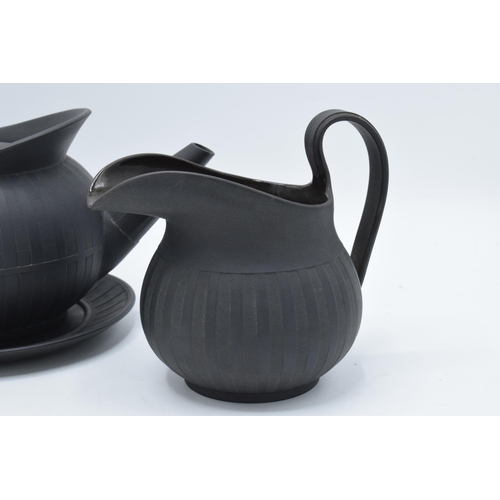 97 - A collection of early 19th century Wedgwood black basalt comprising a globular teapot and cover, a j... 