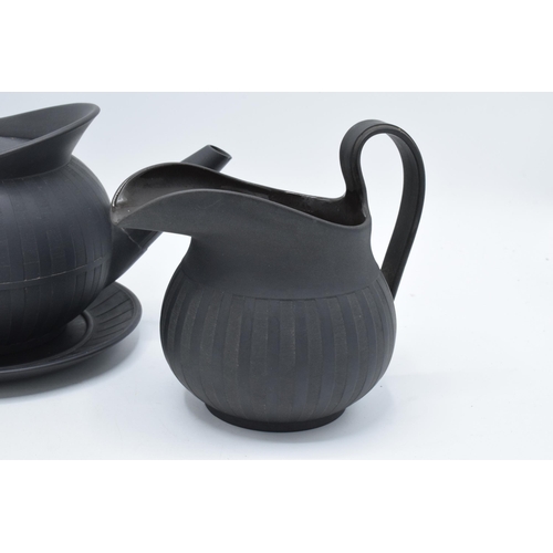 97 - A collection of early 19th century Wedgwood black basalt comprising a globular teapot and cover, a j... 