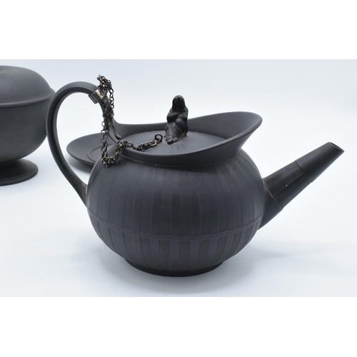 97 - A collection of early 19th century Wedgwood black basalt comprising a globular teapot and cover, a j... 