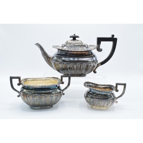 369 - Silver tea pot together with matched silver plated sugar and cream. Teapot weighs 598.8g, bearing Lo... 