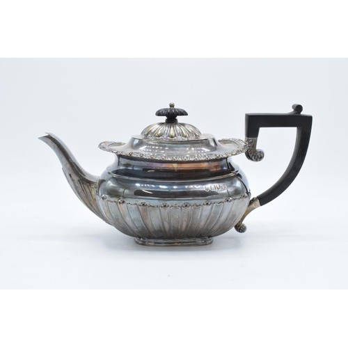 369 - Silver tea pot together with matched silver plated sugar and cream. Teapot weighs 598.8g, bearing Lo... 