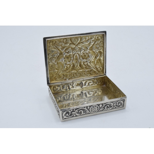 400D - A continental silver ornate repousse antique box, 152.5 grams. 8.5 x 6.5cm.