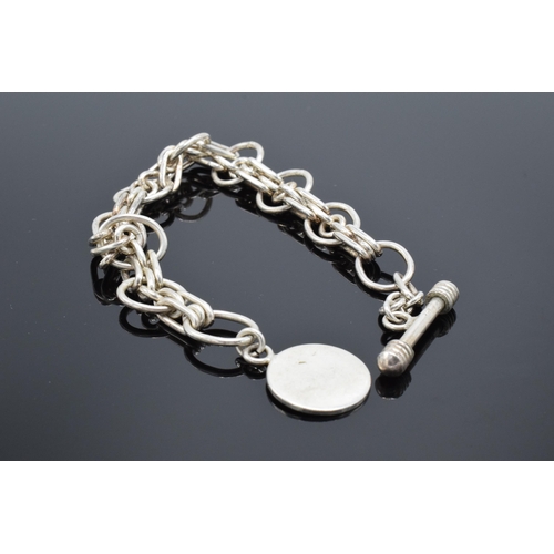 498 - A sterling silver (marked 925) link bracelet with T-bar, 31.3 grams. 23cm long.