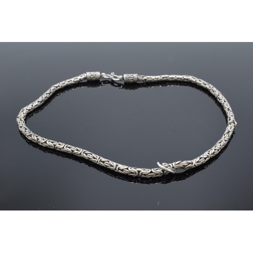 502 - A silver cylindrical necklace, 47.2 grams. 45cm long.