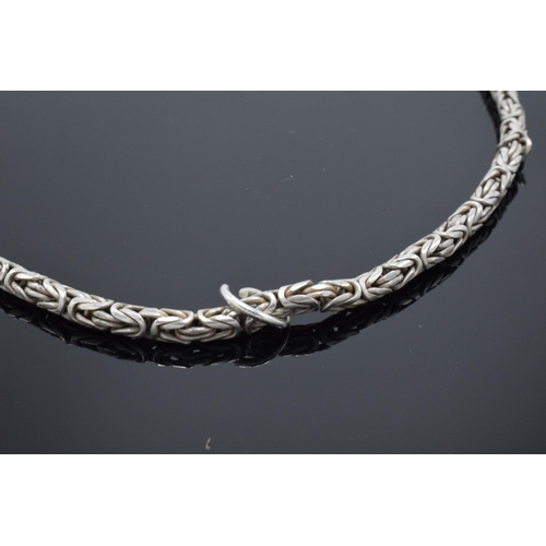 502 - A silver cylindrical necklace, 47.2 grams. 45cm long.