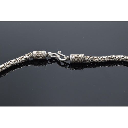 502 - A silver cylindrical necklace, 47.2 grams. 45cm long.