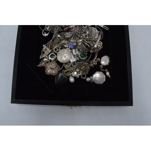 504 - A collection of mainly silver jewellery to include chains, charms, pendants to include St. Christoph... 